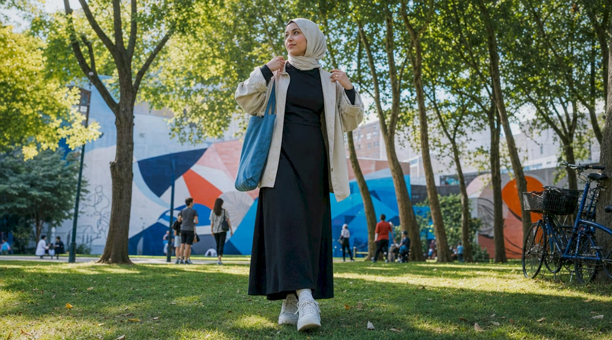 Young Muslim woman wearing modest streetwear outdoors