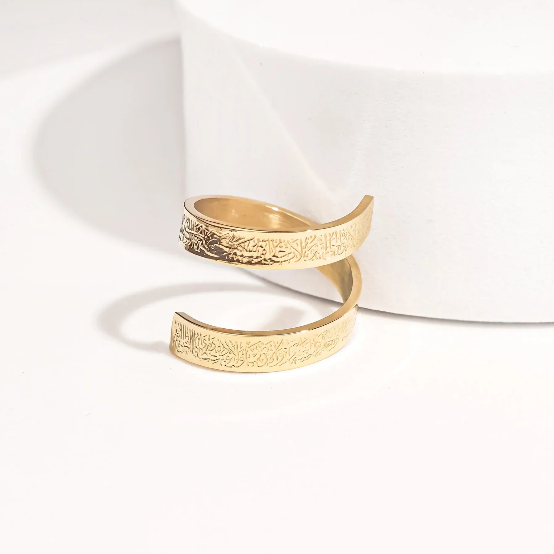 Gold Ayatul kursi Ring with intricate design on a white background